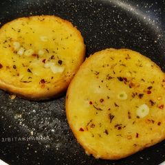 A picture of Toasted Bread with herbs and garlic butter.