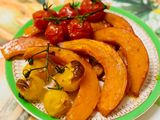 Pumpkin in the oven with tomatoes