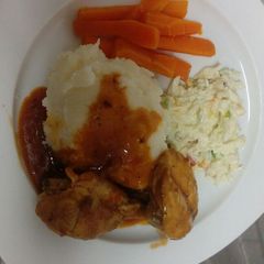 A picture of Mashed potatoes and chicken.