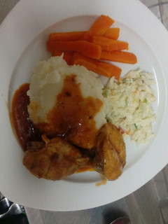 A picture of Mashed potatoes and chicken.