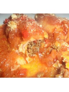 Una foto de Canelones de carne con salsa de tomate