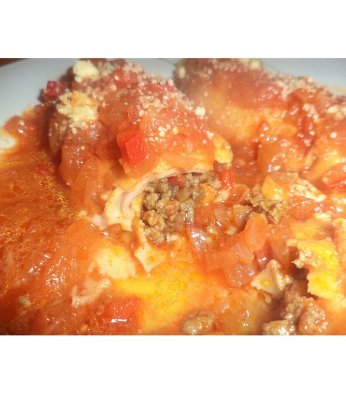 Una foto de Canelones de carne con salsa de tomate