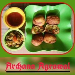 A picture of Bread Roll stuffed Potato Green Peas veg.