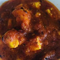 A picture of Tomato paneer.