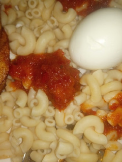 A picture of Simple Macaroni, boiled egg & sauce.
