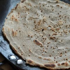 A picture of Bajra Bhakri with seasome seeds.