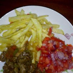 A picture of Chips,beef and Kachumbari.