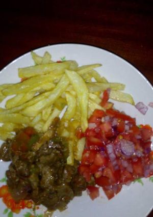 A picture of Chips,beef and Kachumbari.