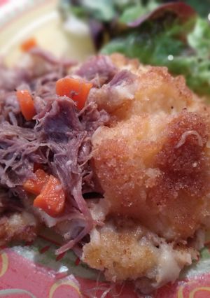 Une photo de Parmentier de canard confit