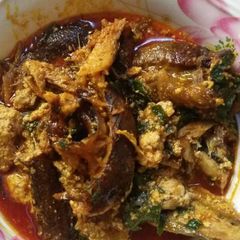 A picture of Egusi soup with smoked fish.