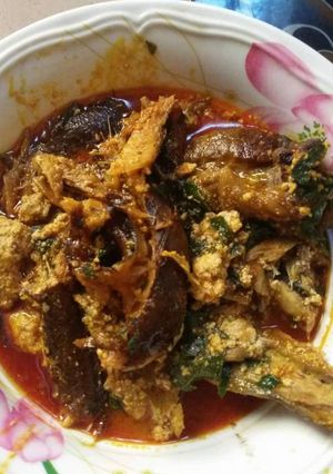 A picture of Egusi soup with smoked fish.