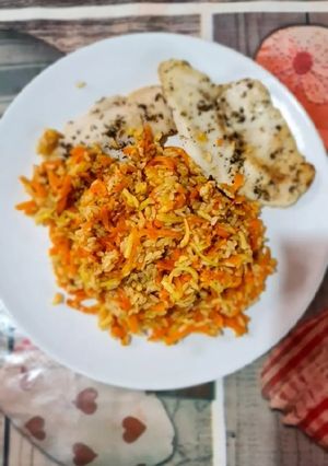 Una foto de Arroz integral con verduras y pescado a las finas hierbas