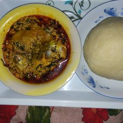 A picture of Poundo yam, Egwusi and fresh fish.