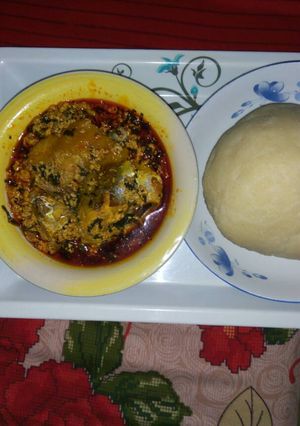 A picture of Poundo yam, Egwusi and fresh fish.