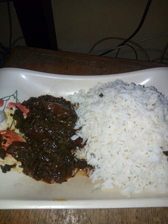 A picture of White Rice and vegetable stew.