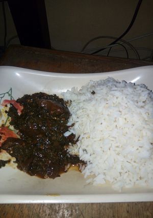 A picture of White Rice and vegetable stew.