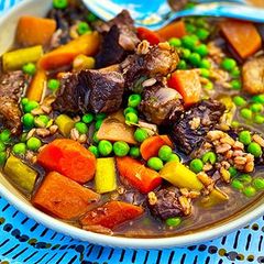 A picture of Wagyu Beef Ragout with Braised Vegetables and Farro.