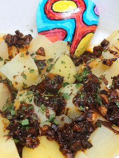 Una foto de Patatas al ajo con especias
