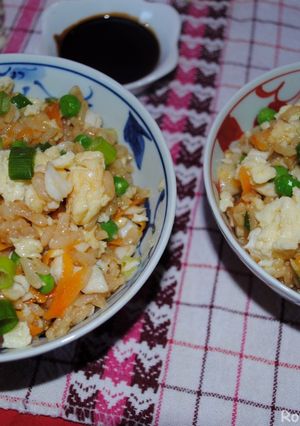 A picture of Rice with salmon fish and vegetables.