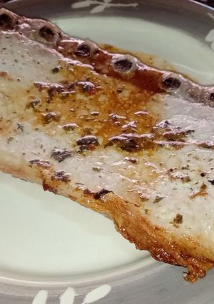 Una foto de Bife de carré de cerdo en la parrilla del horno