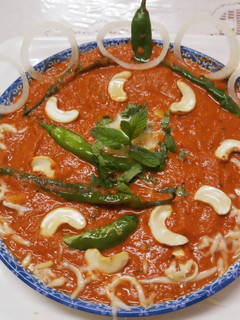 A picture of Shahi Kaju Chilli Moghlai Curry.