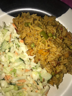 A picture of Fried Rice & coleslaw.