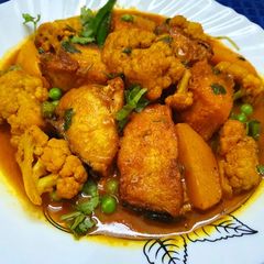 A picture of Rohu Fish Curry or Rui Macher Jhol with Cauliflower and Potato.