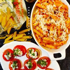 A picture of Italian Penne All' Arrabbiata with Insalata Caprese.