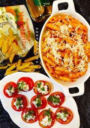 A picture of Italian Penne All' Arrabbiata with Insalata Caprese.