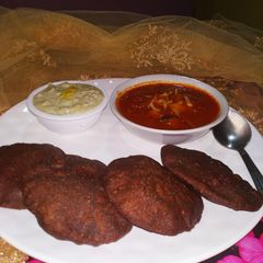 A picture of Ragi Puri With Apple Tomato Ki Sabji.