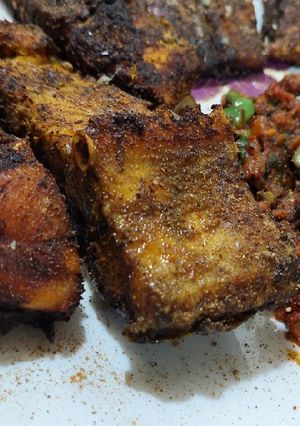 A picture of Fried fish with tomato chutney.