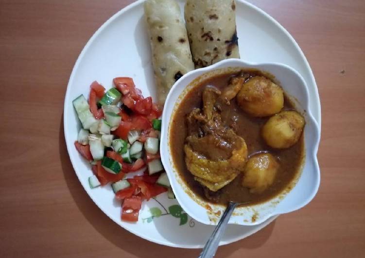 Chicken potato stew with chapati and tomato cucumber salad