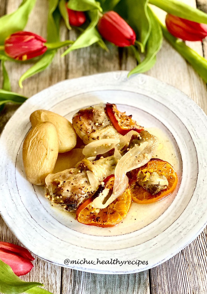 Una foto de Pollo al horno con mandarinas
