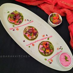 A picture of Stuffed Oats Spinach Pancake with Beetroot Yoghurt spread.