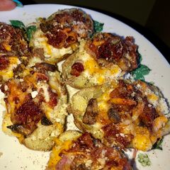 A picture of Super extra fully loaded potato skins 🥓 🍄 🧀 🥔.