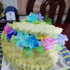 A picture of Eggless pineapple heart shape basket cake.