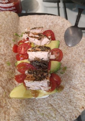 A picture of Salmon Fillet Wraps with Tomato, Mozzarella, and Avocado.