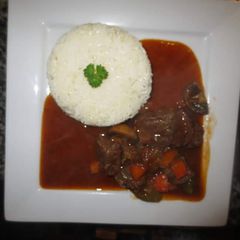 A picture of Beef Stew with Rice.