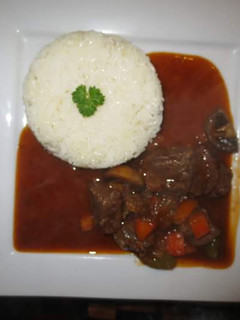 A picture of Beef Stew with Rice.