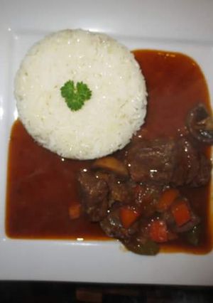 A picture of Beef Stew with Rice.