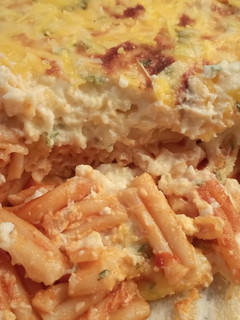 Una foto de Casarecce gratinados con tomate y bechamel
