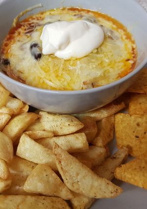 A picture of My Chilli Beef Topped with melted Cheese. 😘.