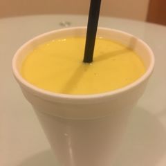 A picture of Mango Lassi   (sweetened mango-yogurt drink).