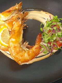 A picture of Flambéed Prawns served with tipsy 1000 island sauce.