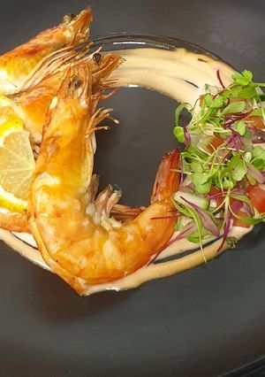 A picture of Flambéed Prawns served with tipsy 1000 island sauce.