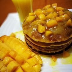 A picture of Mango pancake with mango sauce.