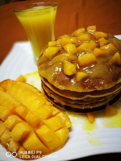 A picture of Mango pancake with mango sauce.