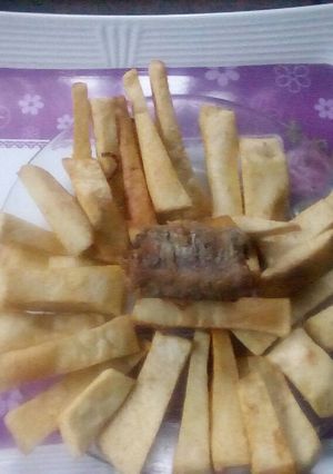 A picture of Peppered fried yam and fish.