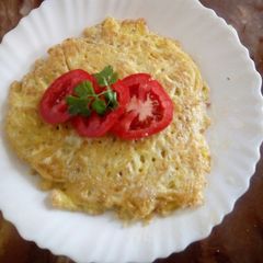 A picture of Spaghetti in eggs.