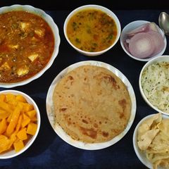 A picture of Mutter paneer, paratha with zeera rice and dalfry.